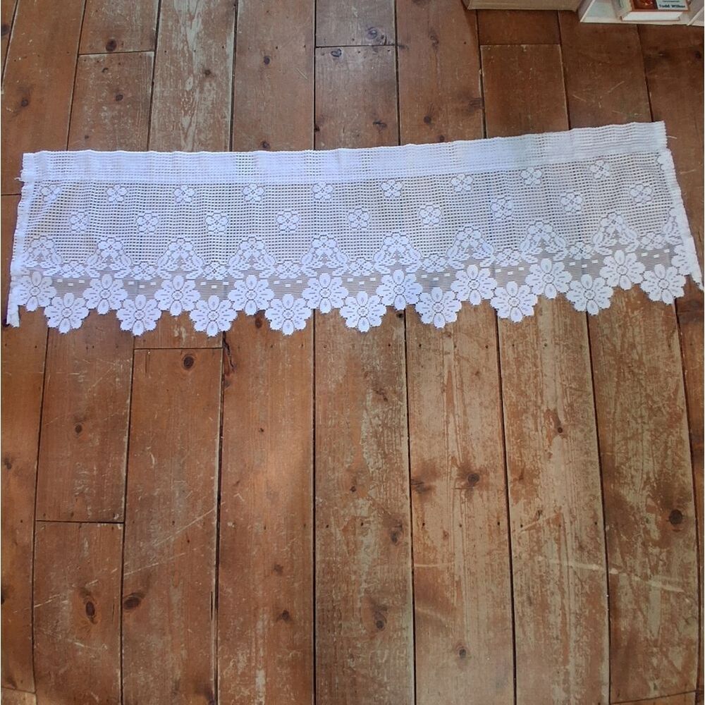 Lovely 66" L white heritage lace with floral design valance.